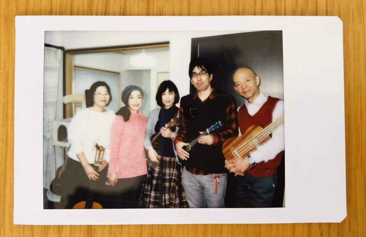 Kazuko-san (plays piano in Mae Maes but guitar in this case), Mitsuko-san (percussion), Sachiko-san (tenor ukulele), Kobayashi-san (soprano ukulele) and Yano-san (bass ukulele)