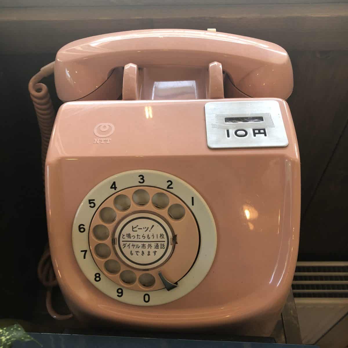 Artifacts: Phone, pink, rotary dial, 10 yen slot (in a coffee shop in Nozawa Onsen)